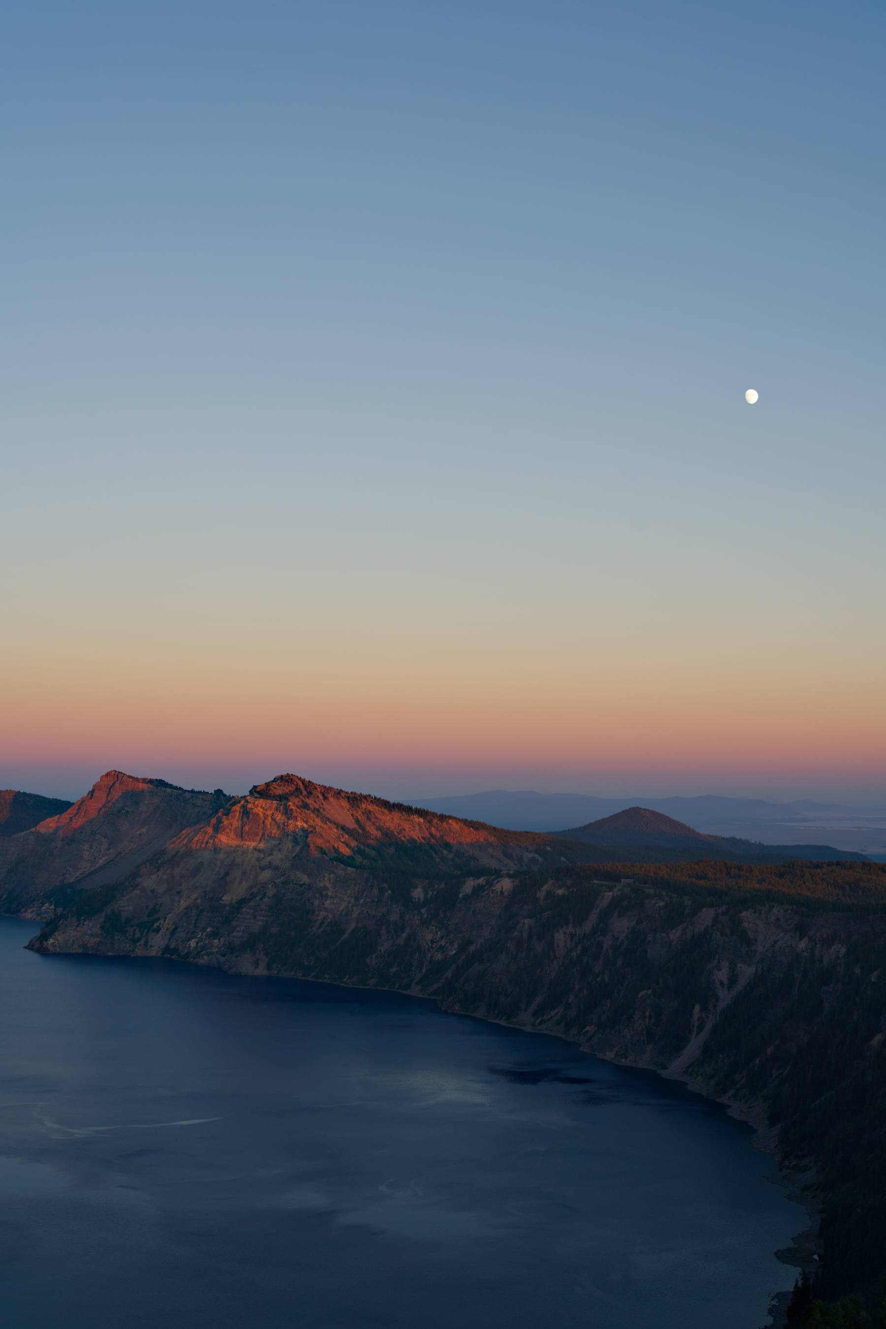 moonrise over crater lake national park, oregon